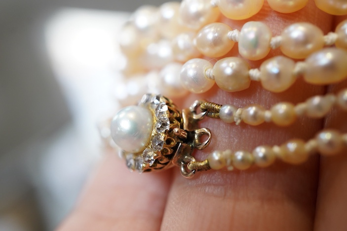 A natural pearl and diamond necklace, early 20th century